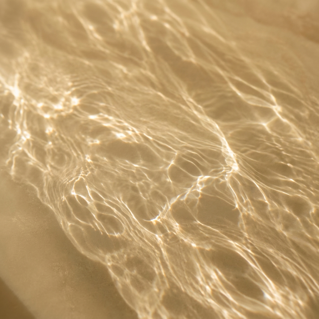 Shimmering golden water with gentle ripples